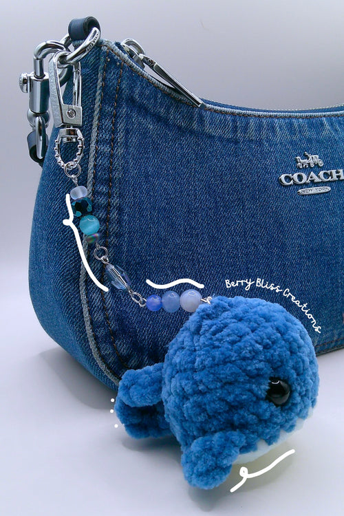 A  blue crocheted whale charm and beaded keychain attached, (Coach shoulder bag not included)